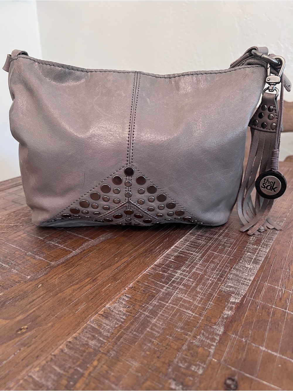 The Sak Taupe Gray Leather Studded Crossbody with Tassel